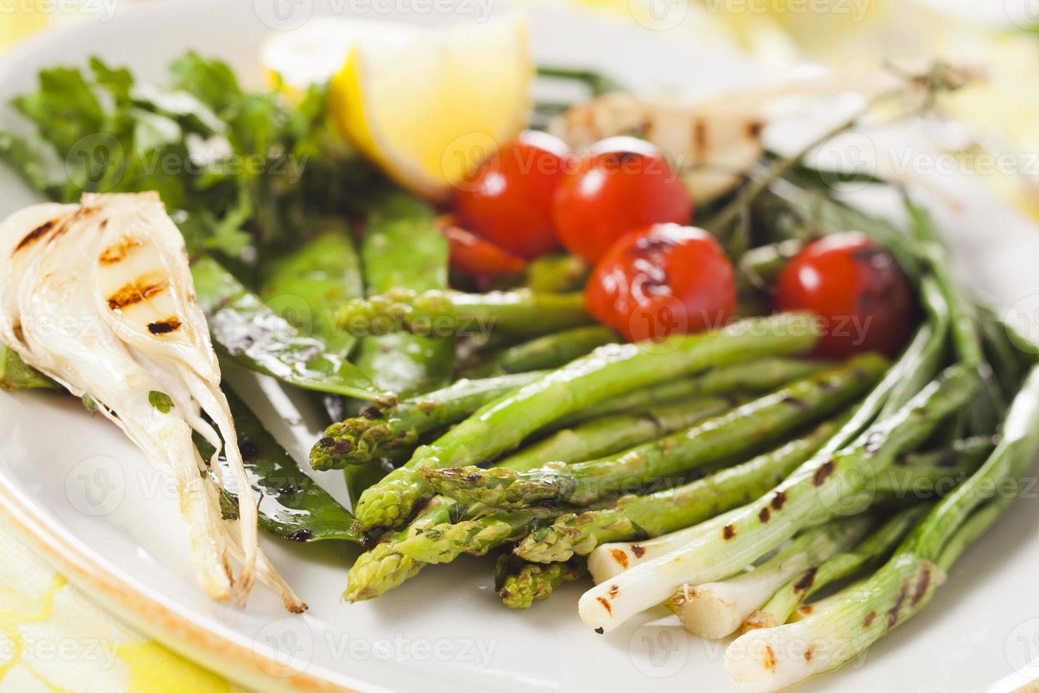 marinated grilled vegetables - asparagus, onions, peas, tomatoes photo