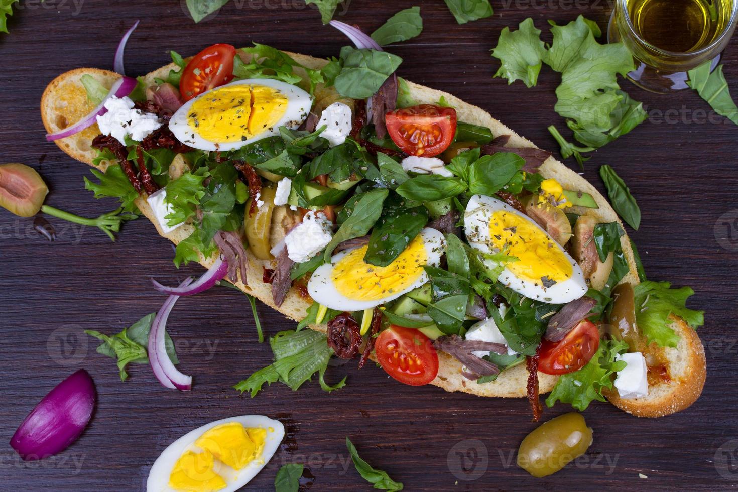 Greek Steak Salad on Bread with Eggs and Feta photo