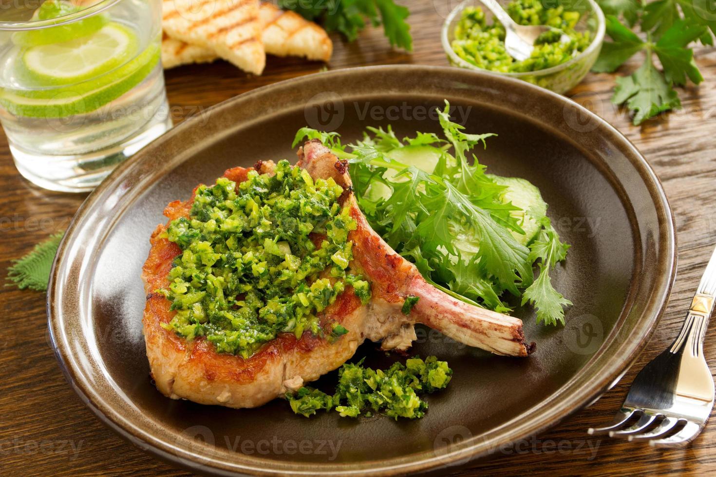 natural cutlet on the bone with gremolatoy. photo