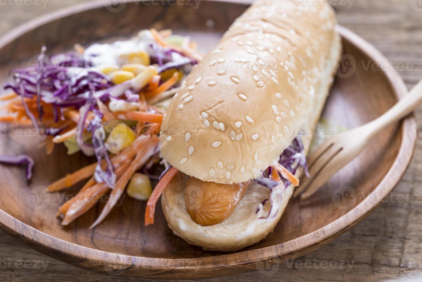 Hotdog bun with sausage photo
