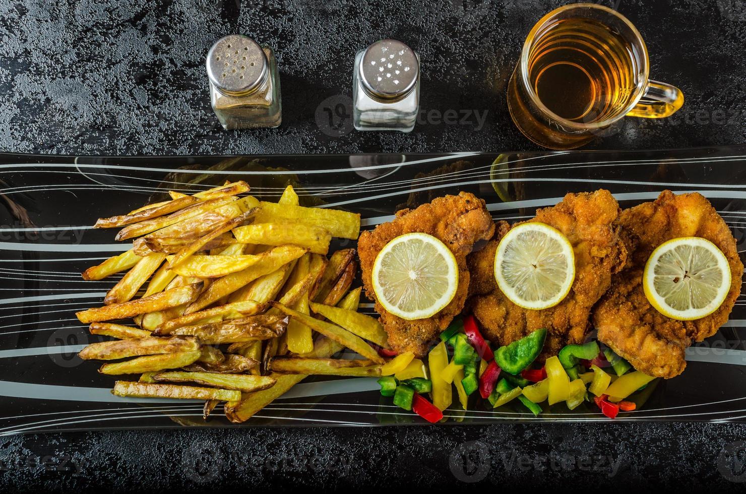 Schnitzel with french fries photo