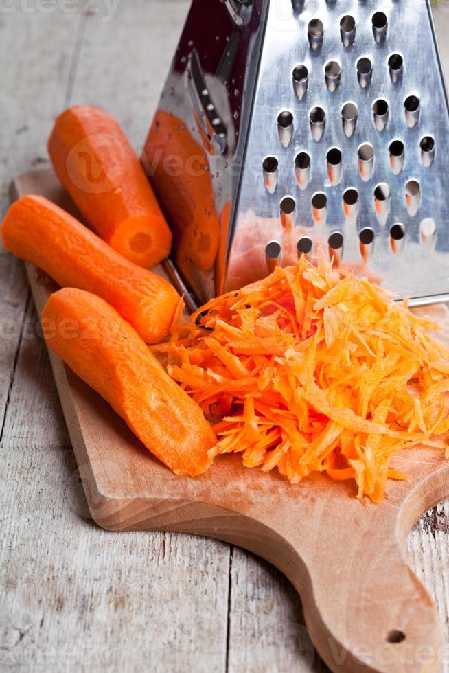 metal grater and carrot photo