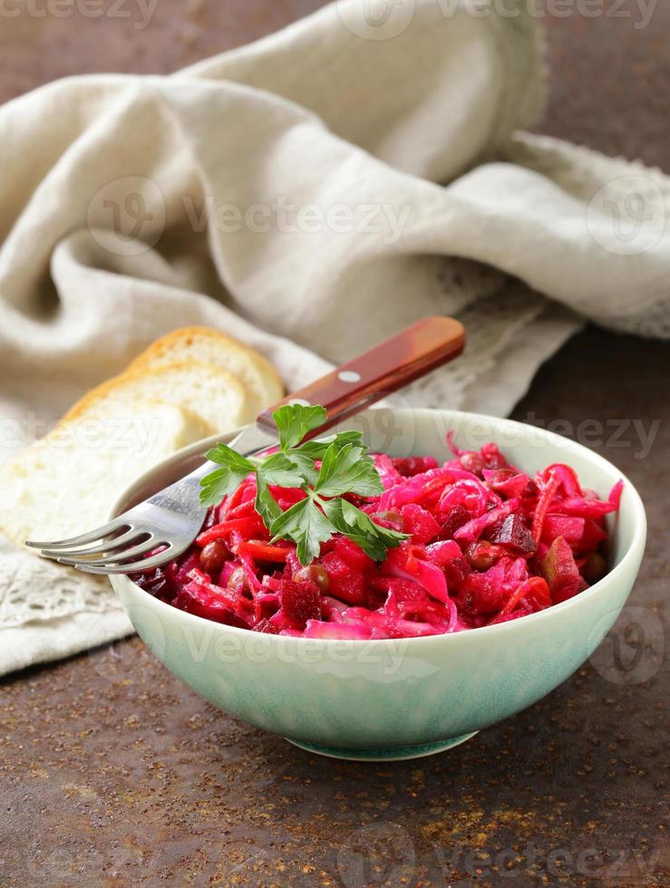traditional Russian salad of beetroot and pickled cabbage (vinigret) photo