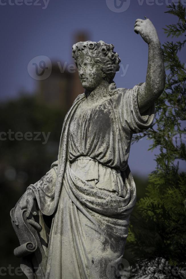 Statue of Woman with Arm Raised photo