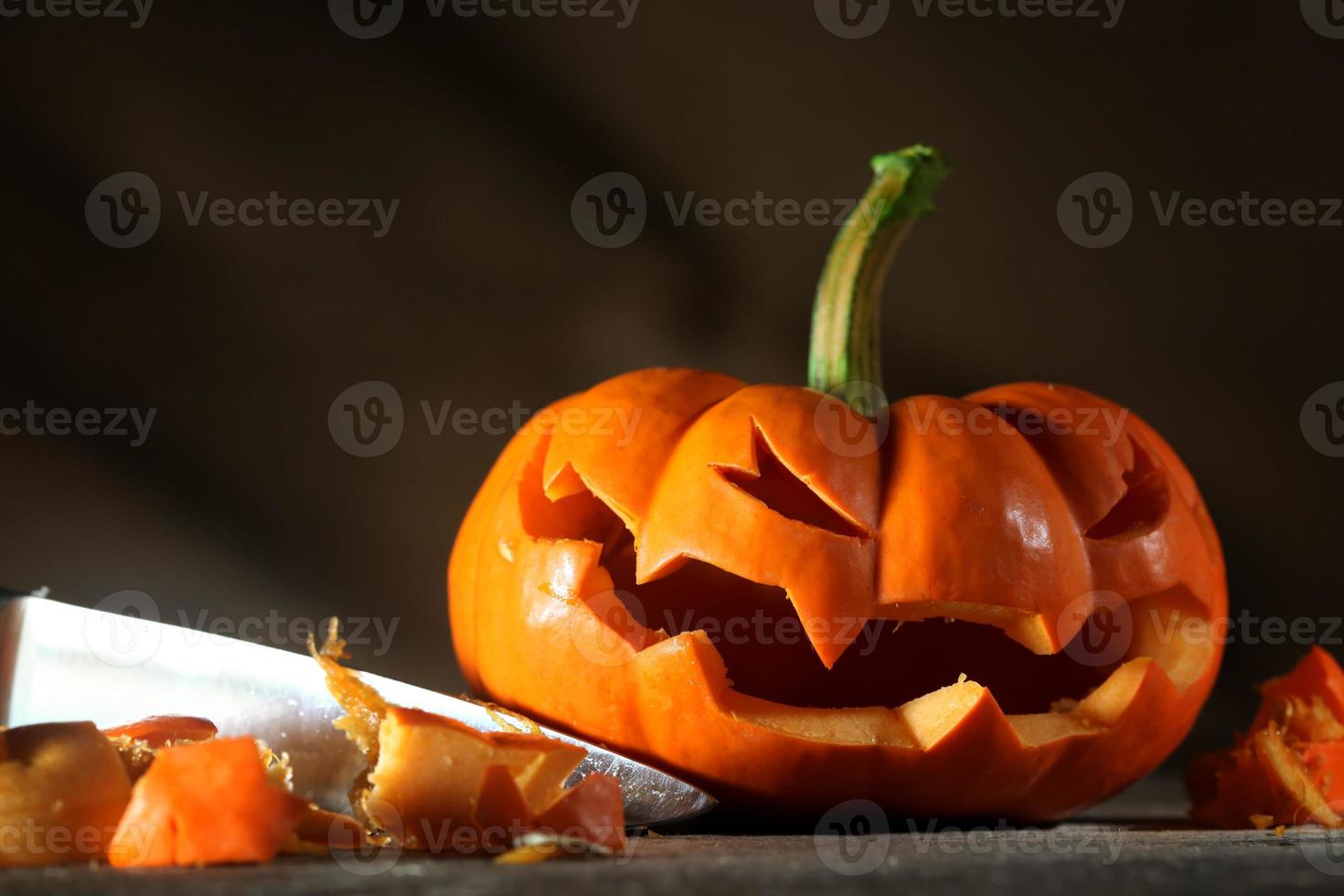 Carving a Halloween jack o' lantern photo