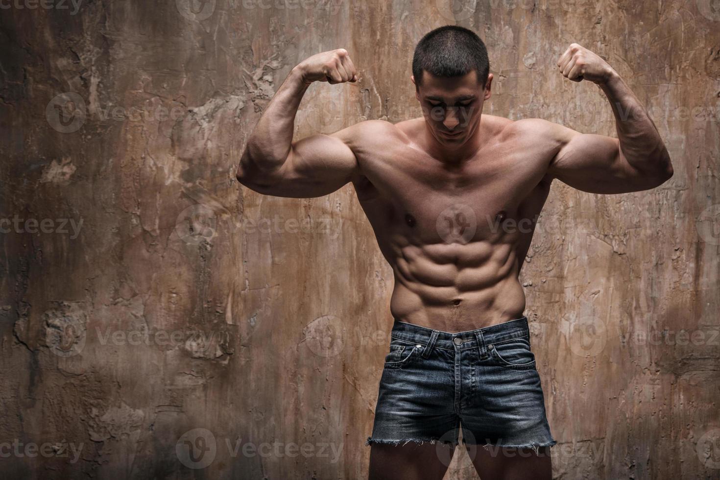 Muscular Man On Wall Background Strong Man 7161 Stock Photo