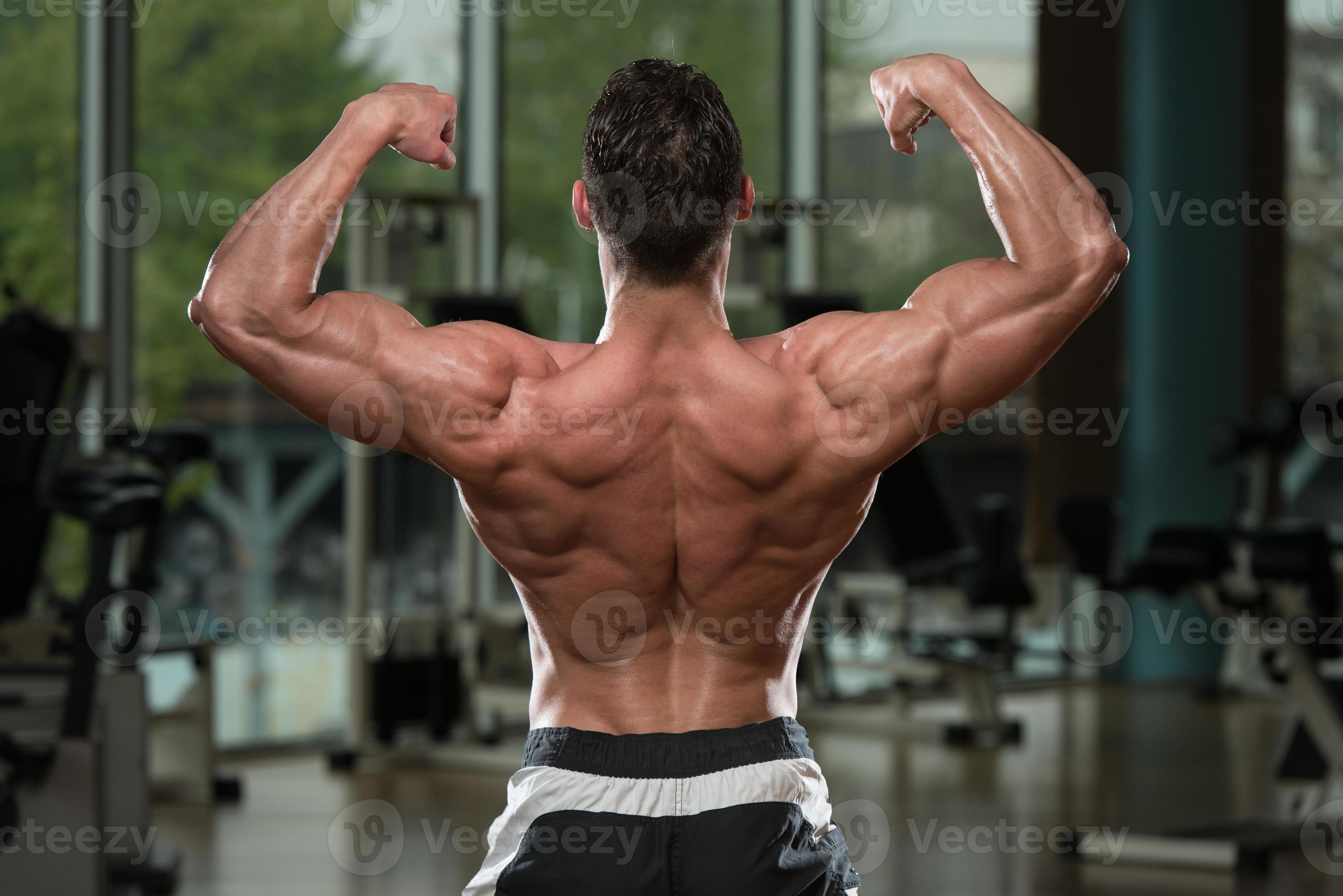 Bodybuilder Performing Rear Double Biceps Pose 783198 Stock Photo at