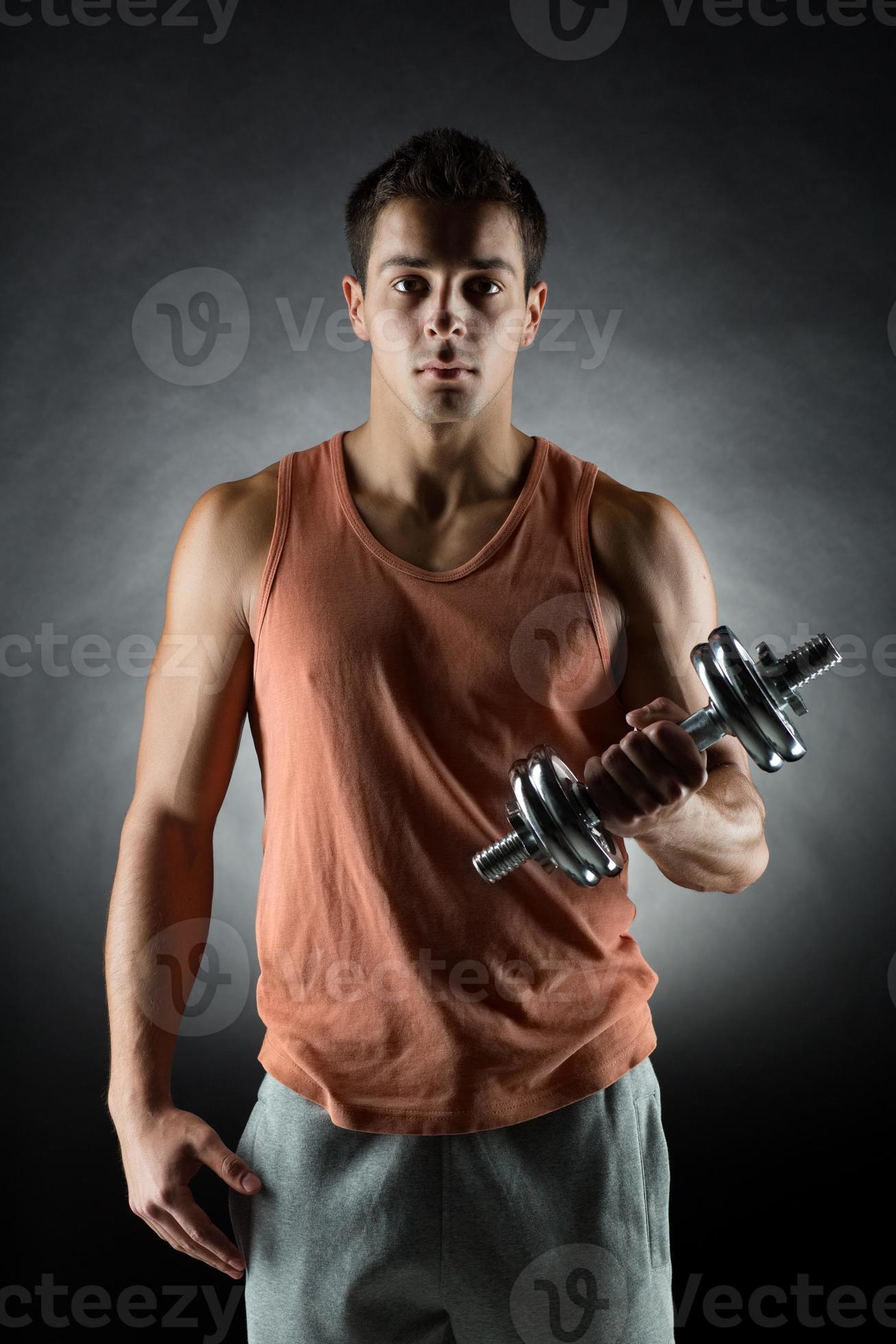 young man with dumbbell photo