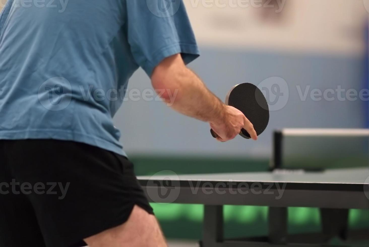 table tennis player waiting for the ball photo