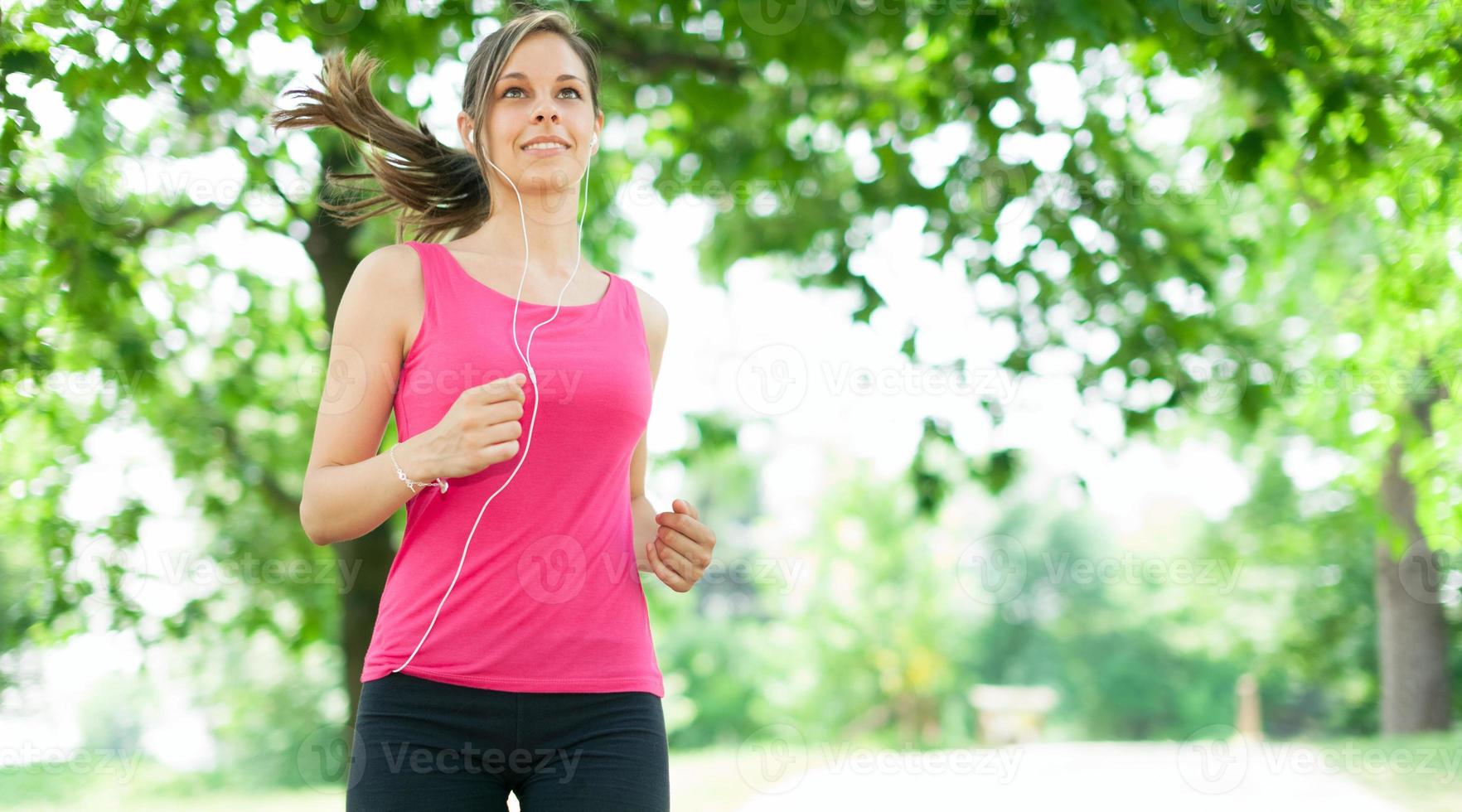Woman running outdoors photo