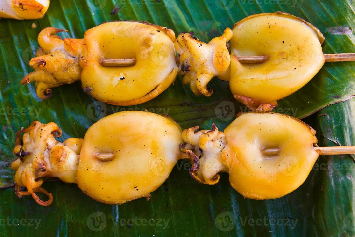 Grilled squid on banana leaves photo