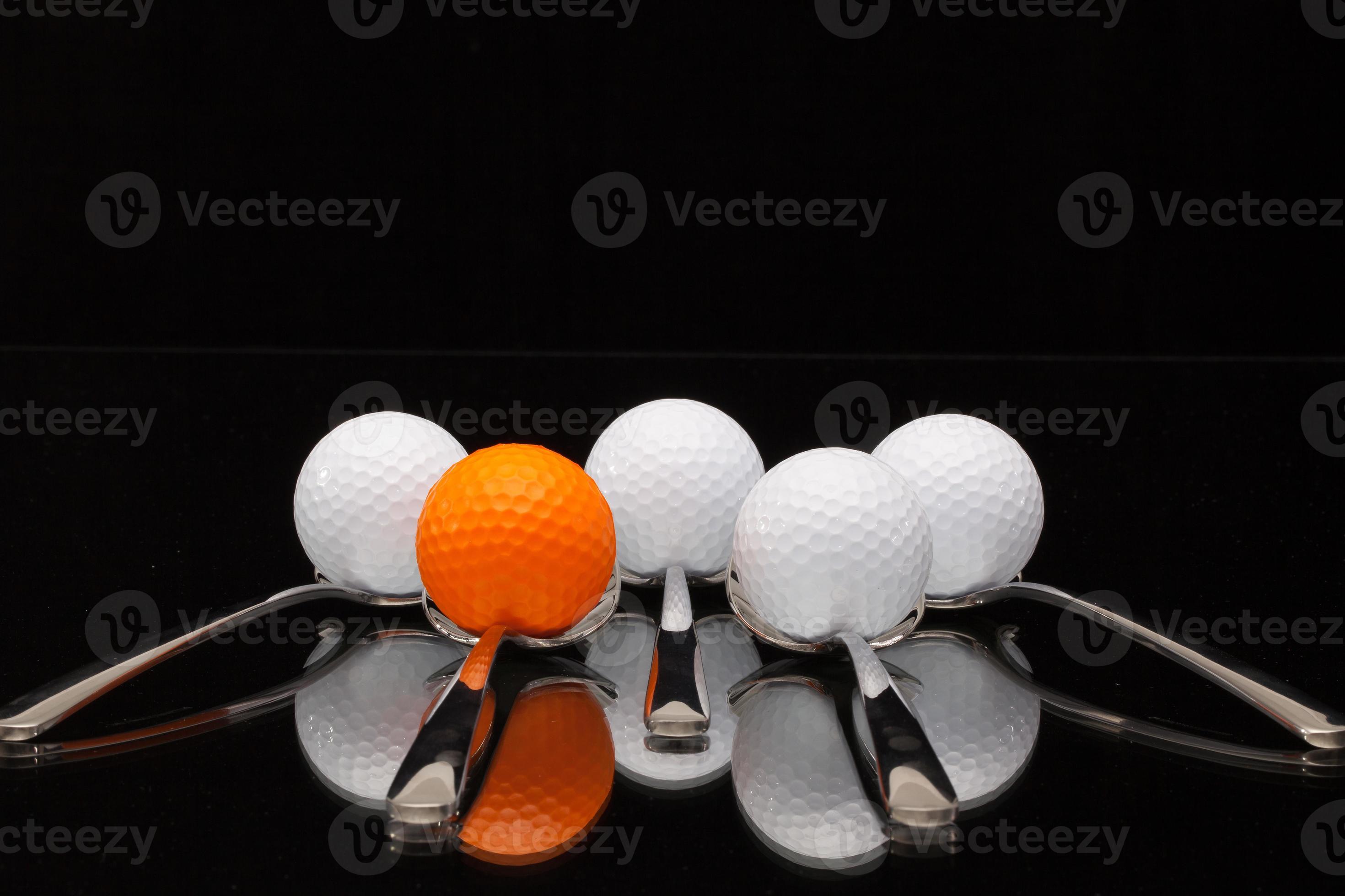 Five spoons and golf balls 786819 Stock Photo at Vecteezy