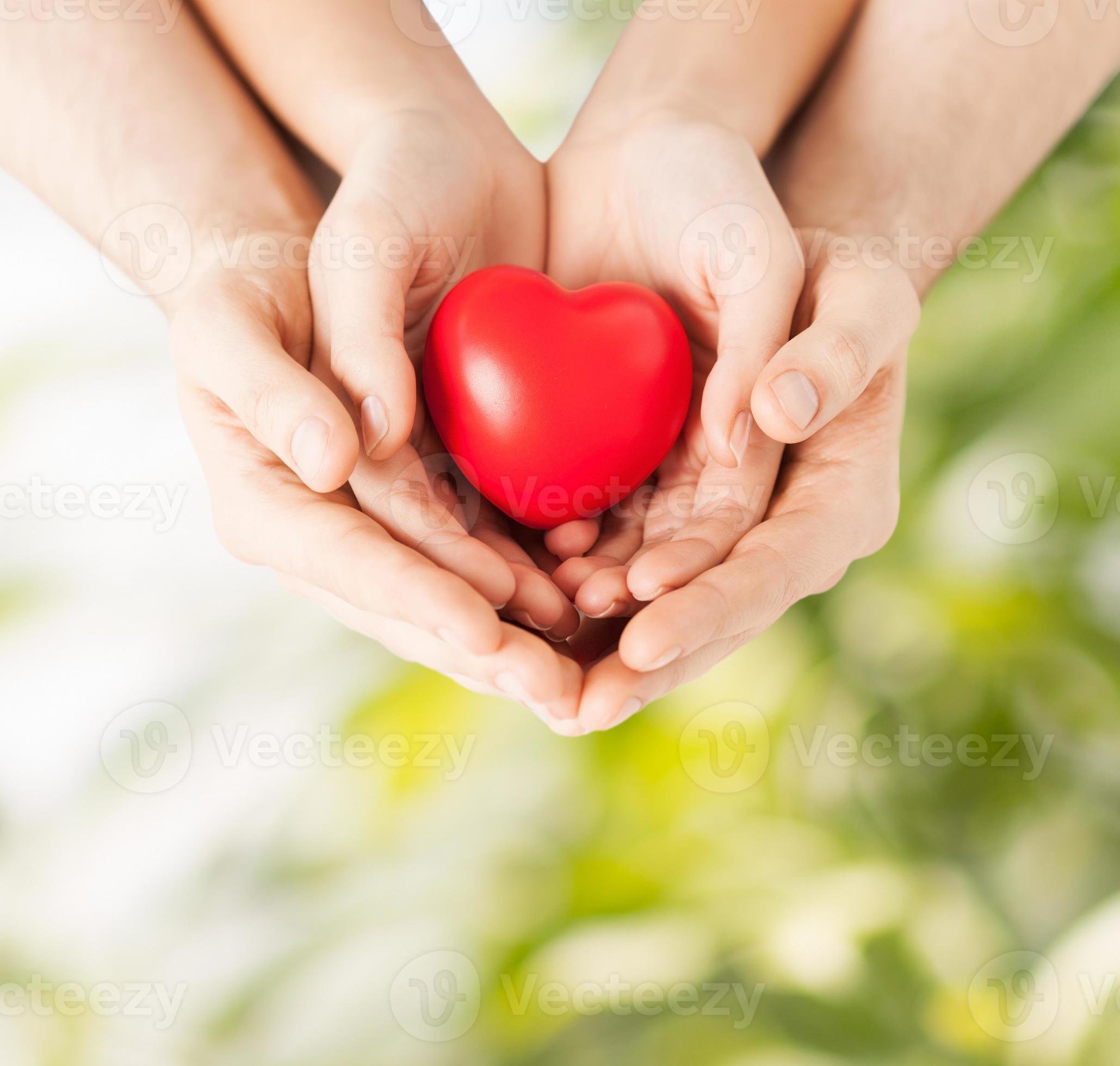 Couple Hands Holding A Heart Together Stock Photo
