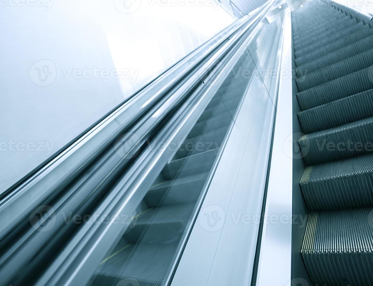 blue modern escalator in business center photo