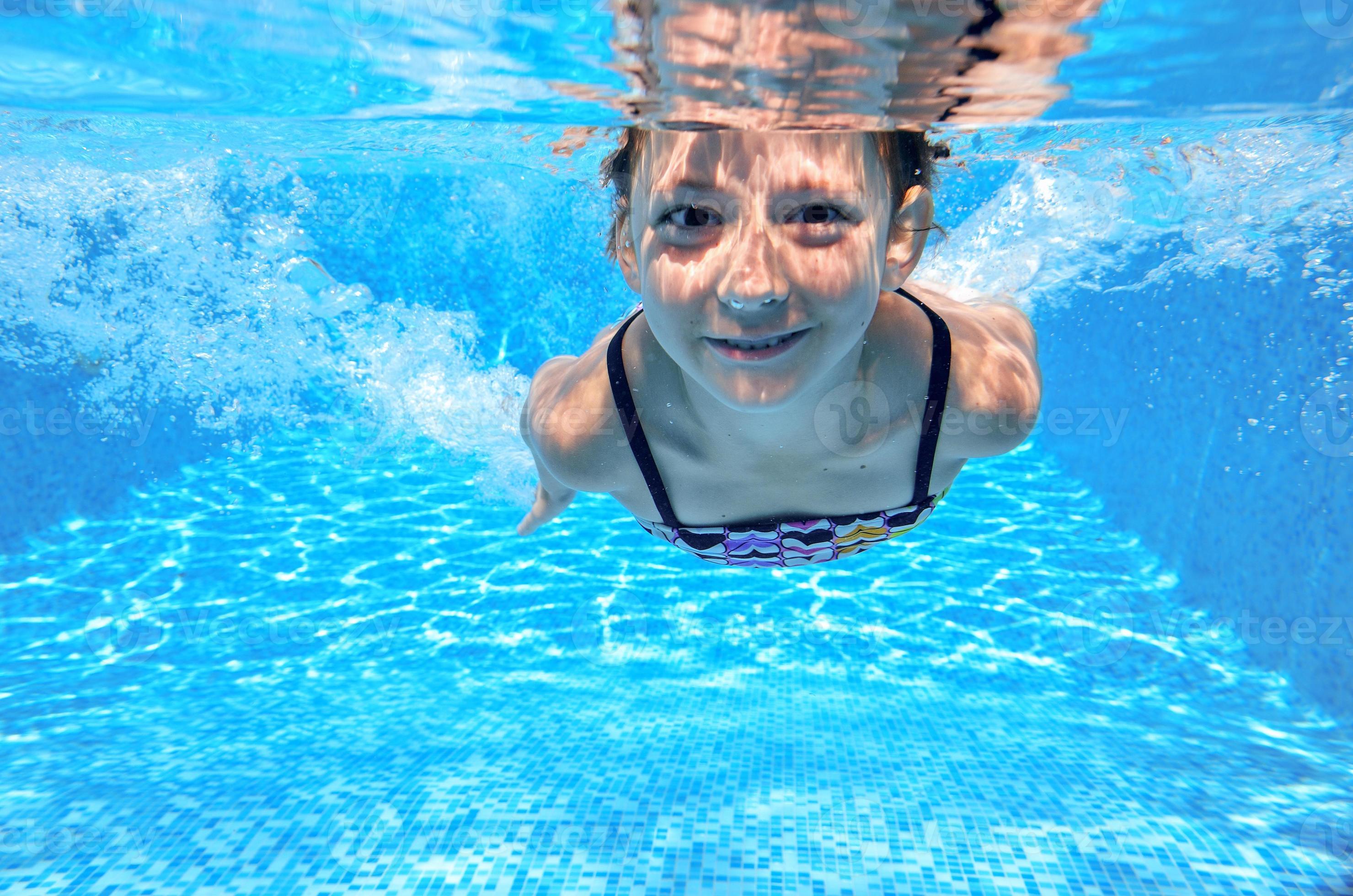 Happy active underwater child swims in pool 788226 Stock Photo at Vecteezy