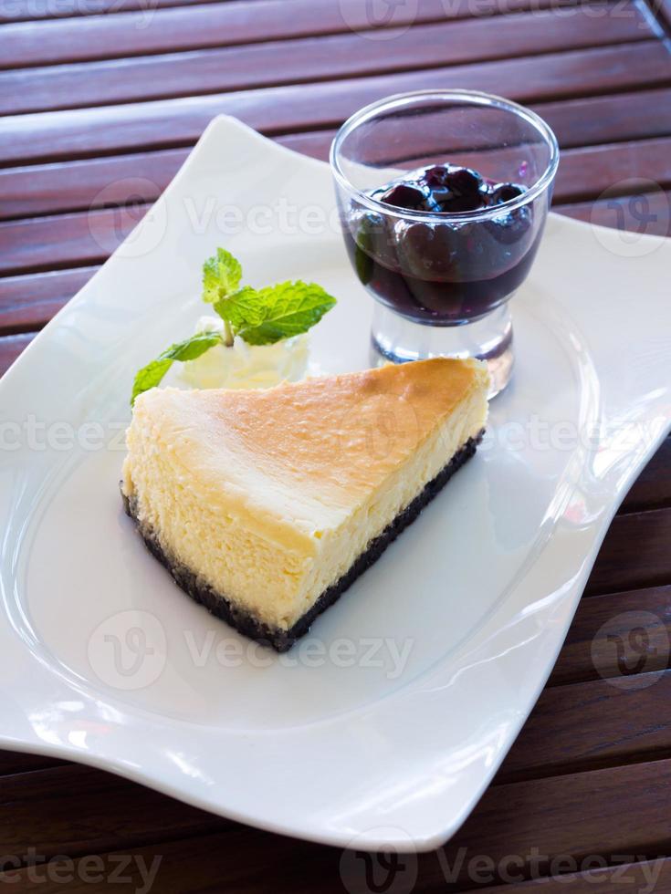 New York Fresh cheesecake with blueberry jam photo