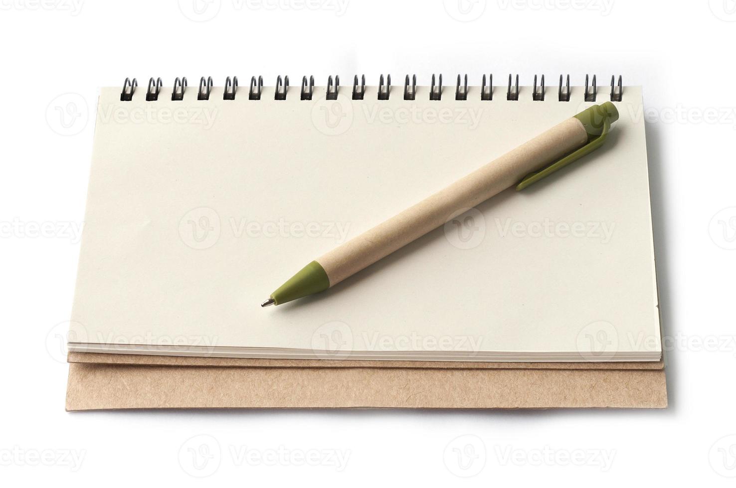 notebook and brown pen isolated on white background photo