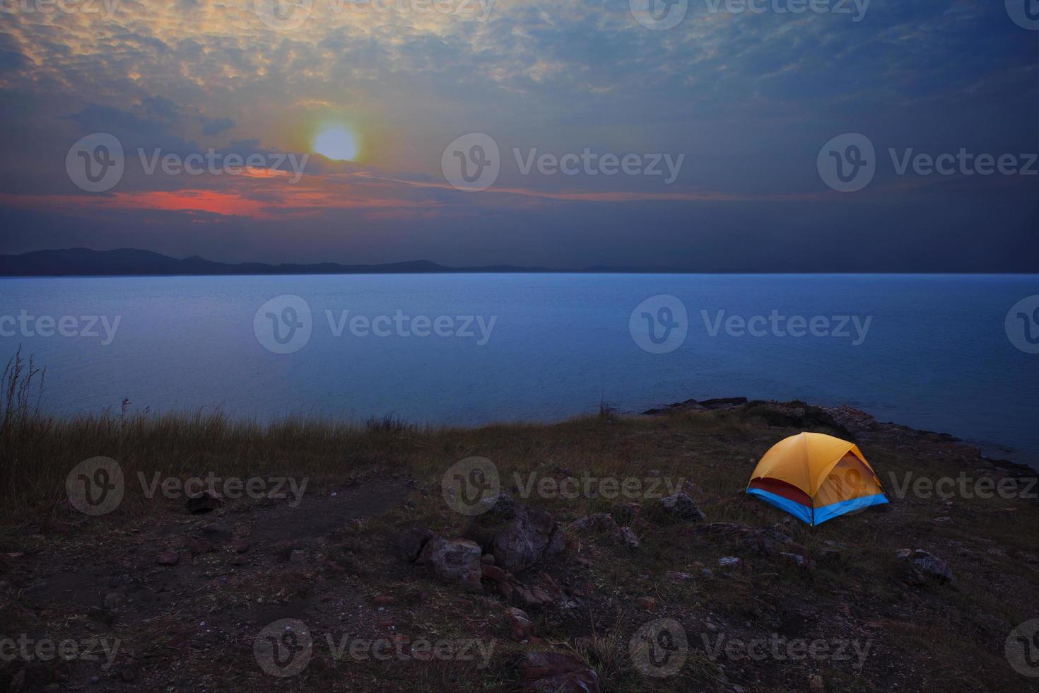 camping tent beside sea beach with morning sky photo