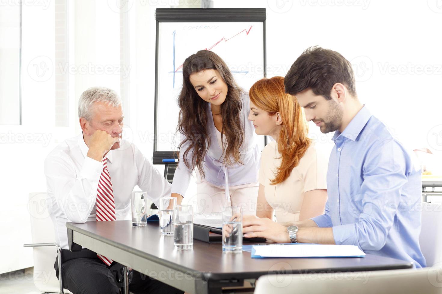 Business people discussing in a meeting photo