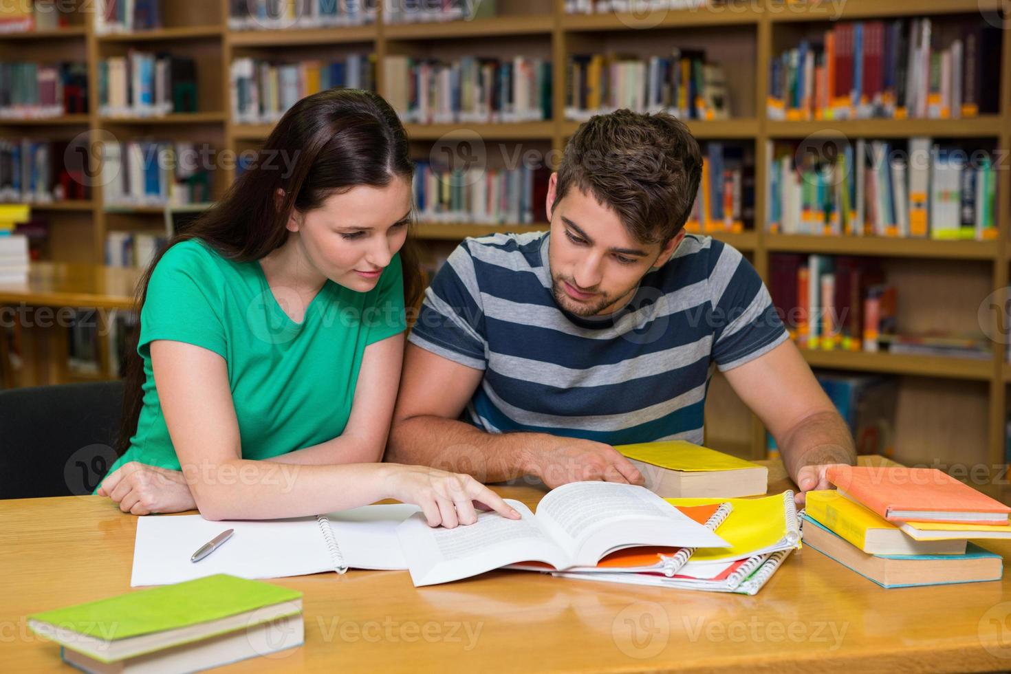 Students studying together in the library photo