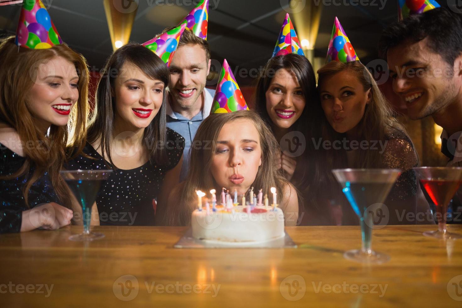 Friends celebrating a birthday together photo