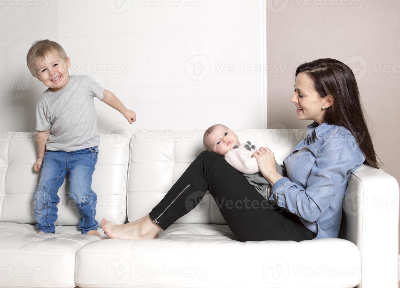 Mother with baby sofa photo