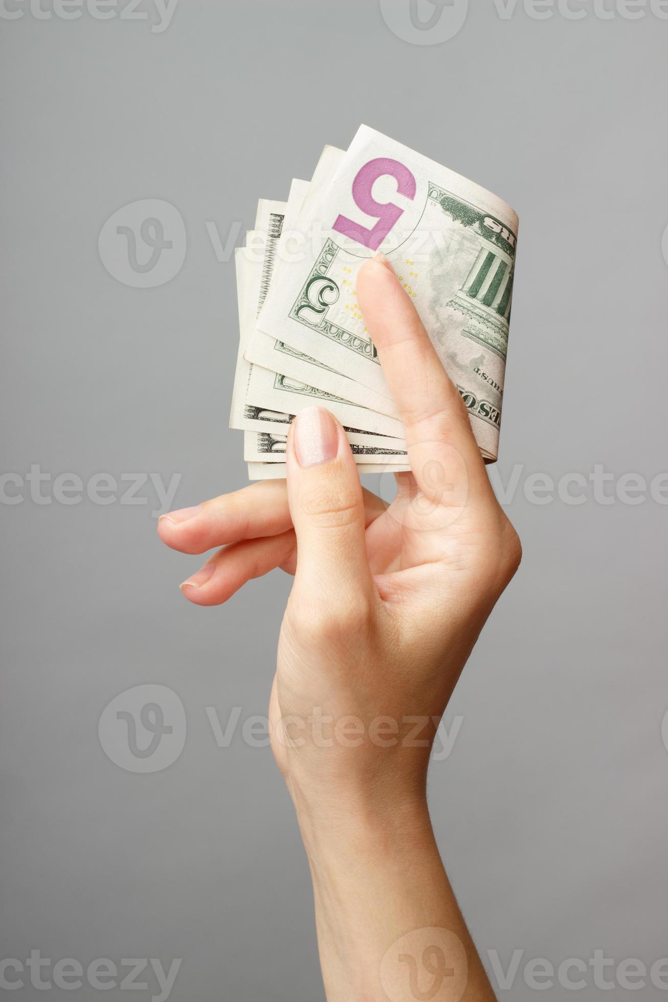female hand holding money 797841 Stock Photo at Vecteezy
