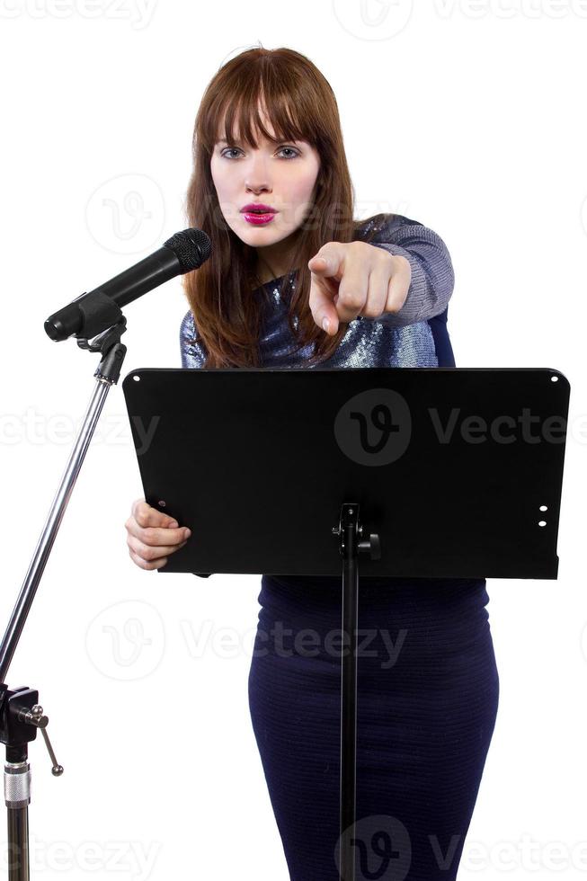 Female Public Speaker With Microphone and White Background photo