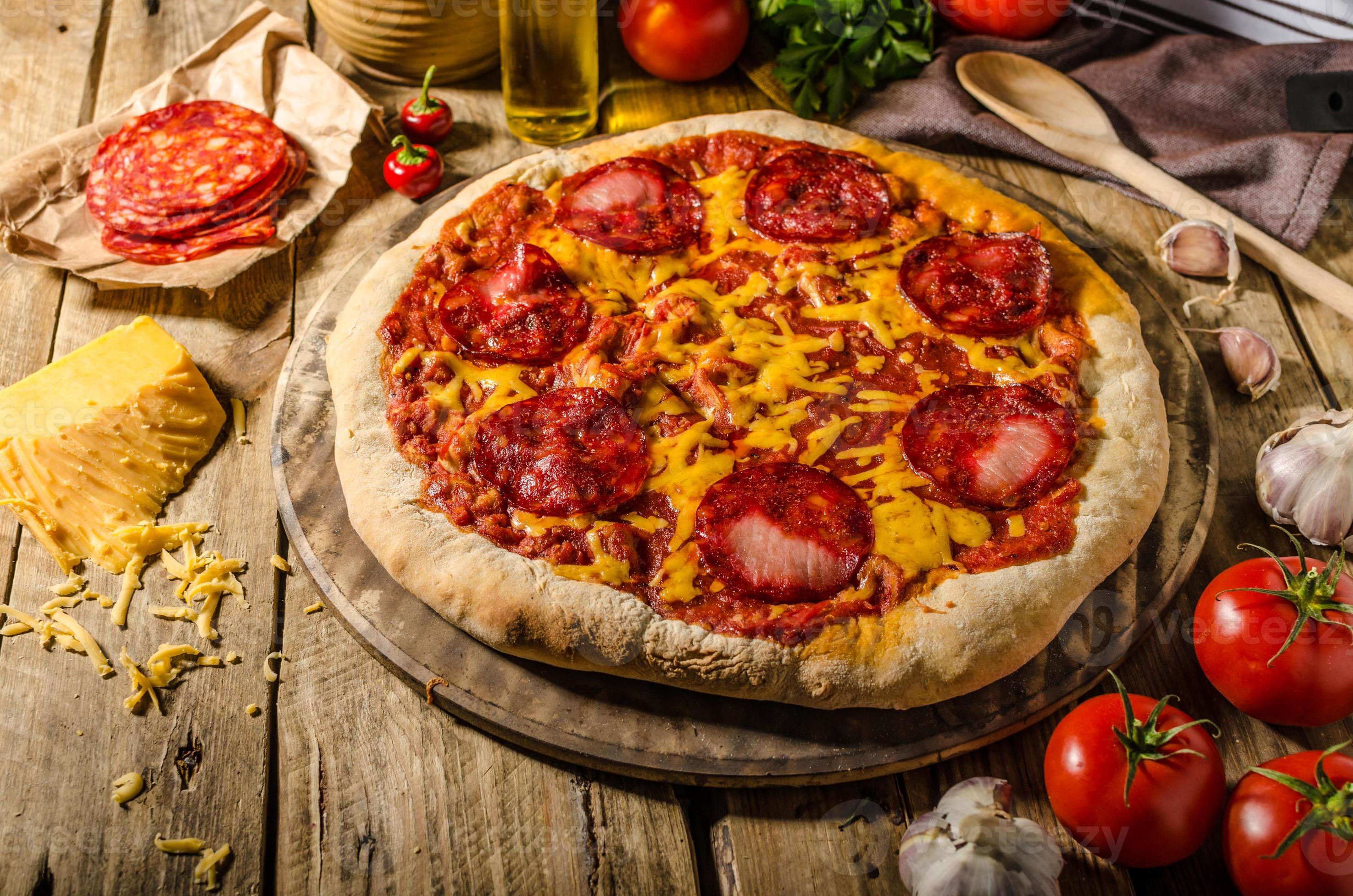 Rustic salami pizza with cheddar cheese and chorizo 806259 Stock Photo ...