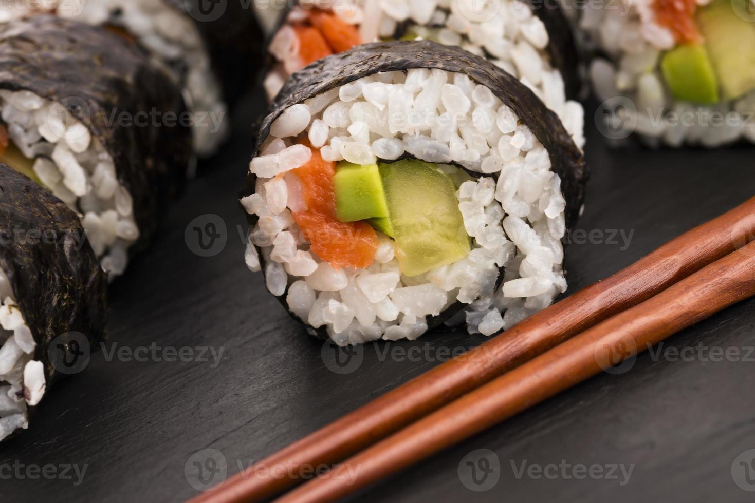 Salmon rolls served on a plate photo