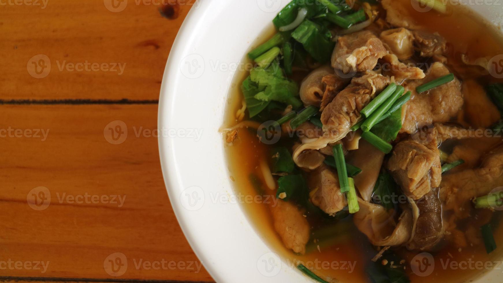 pork noodles in soup asian style photo