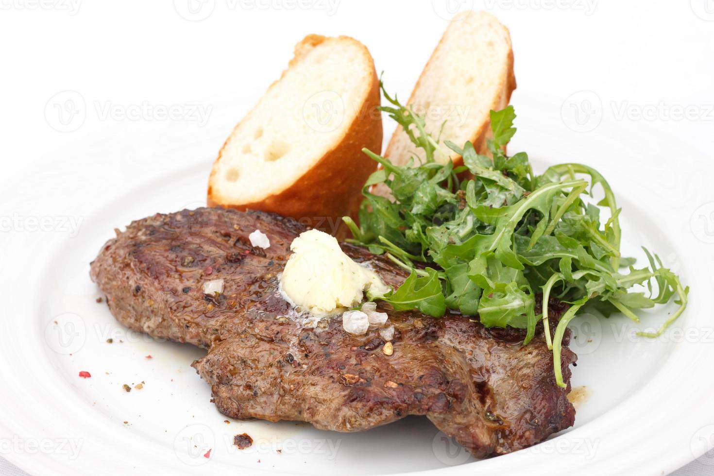 Perfect roast pork rib eye steak with baguette photo