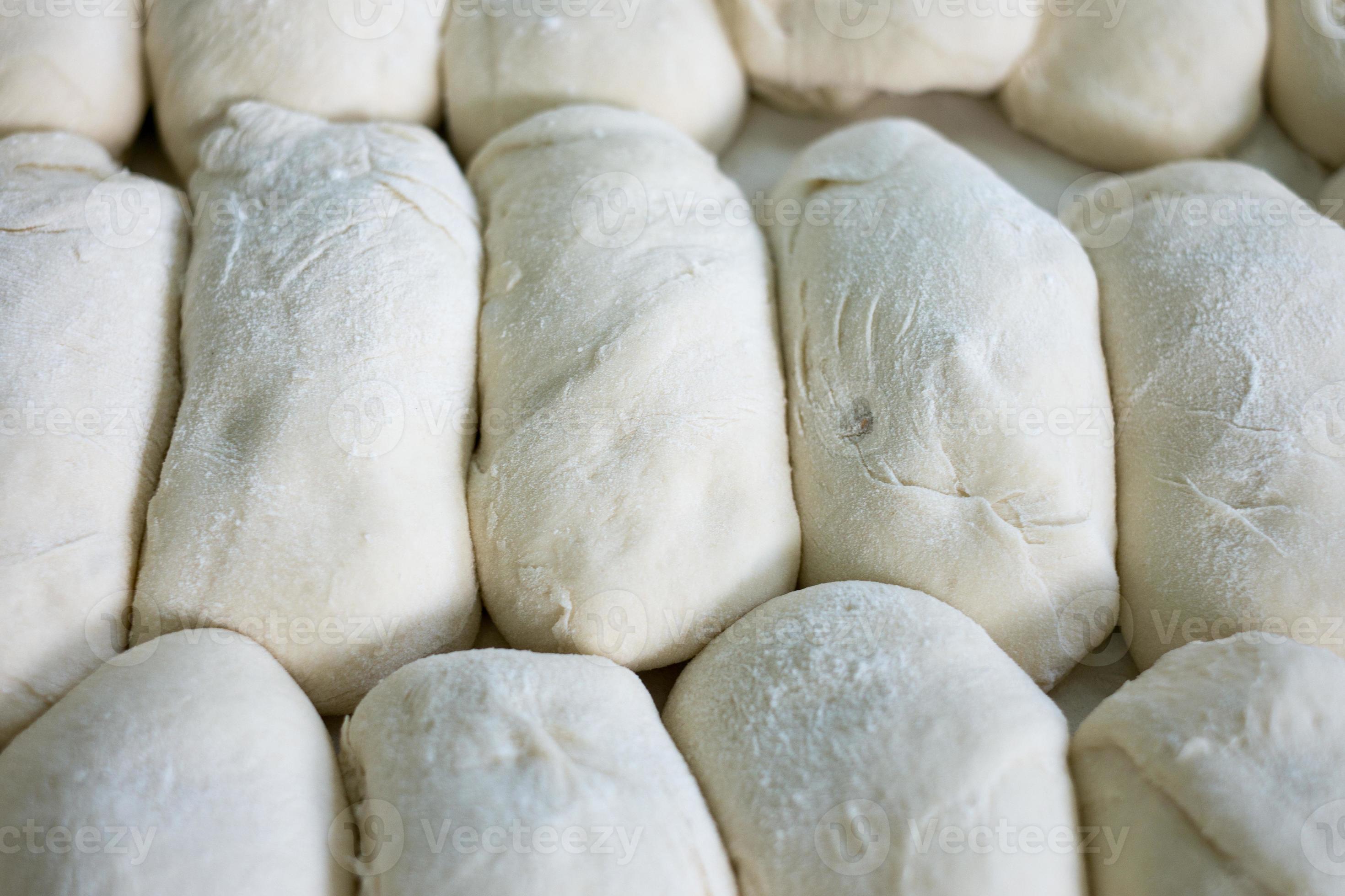 tray-of-freshly-prepped-raw-bread-dough-809732-stock-photo-at-vecteezy