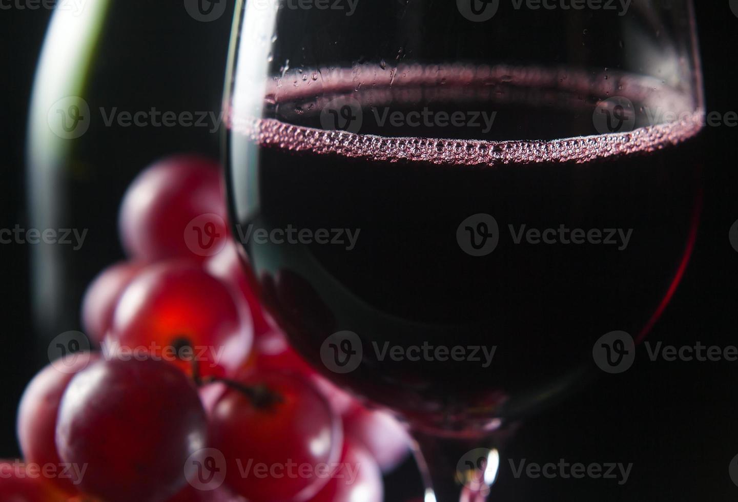 grape and glass with red wine photo