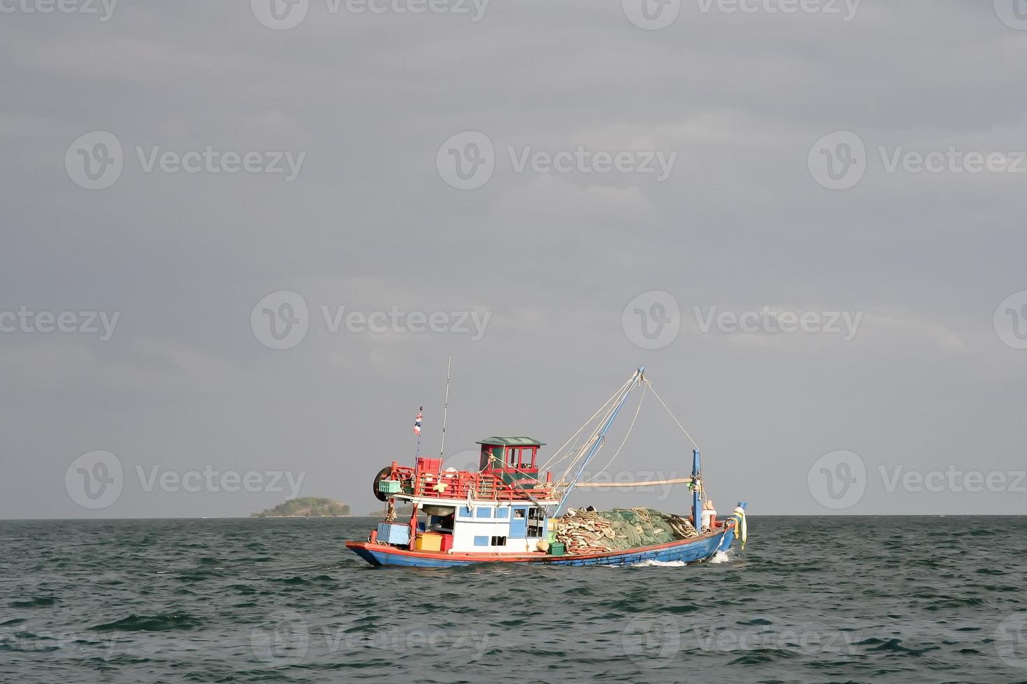 wooden local fisherboat at the ocean photo