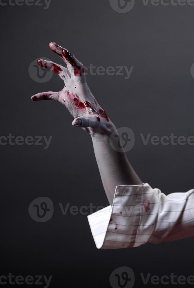 Creepy zombie hand, extreme body-art photo