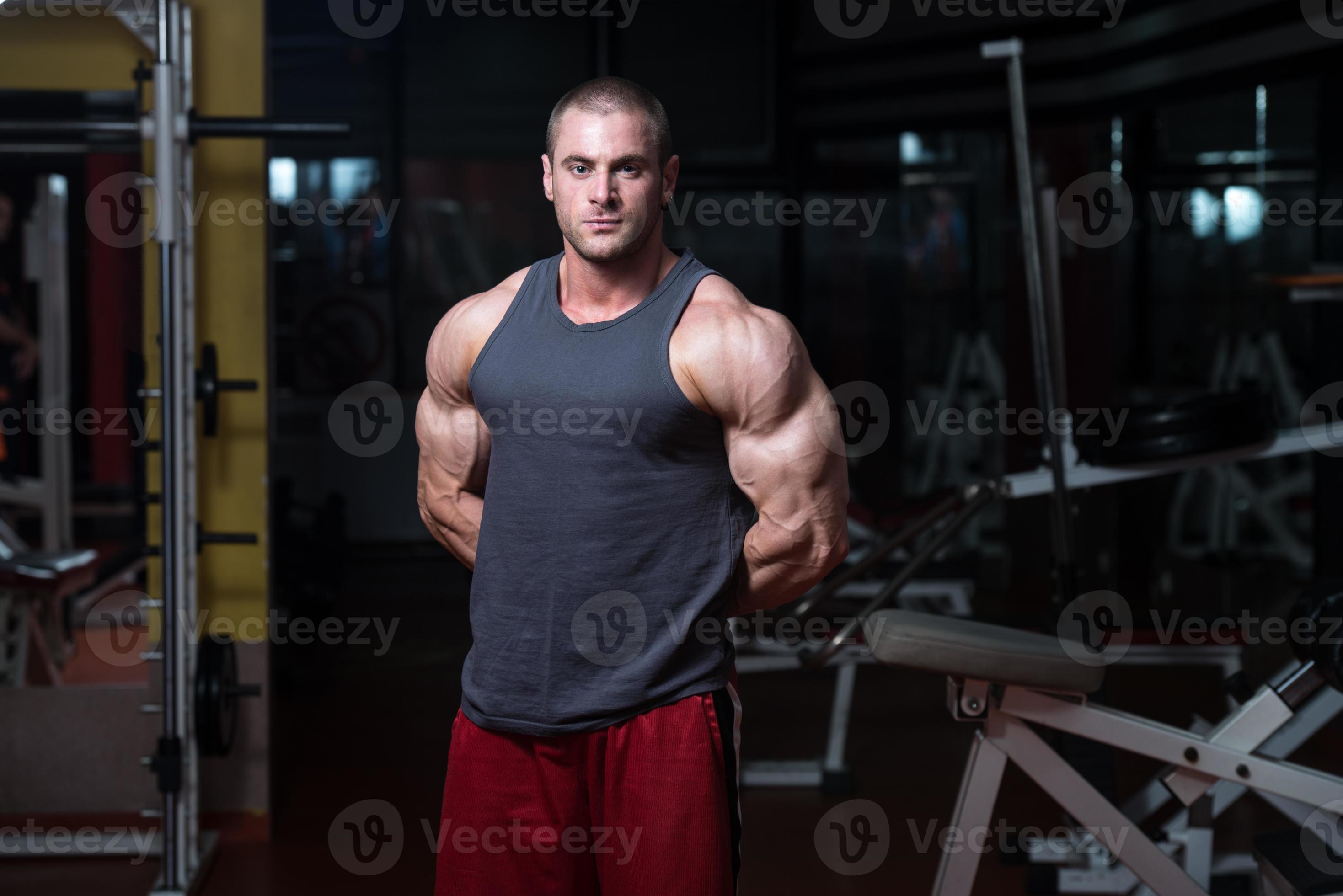 Young Bodybuilder Flexing Muscles photo