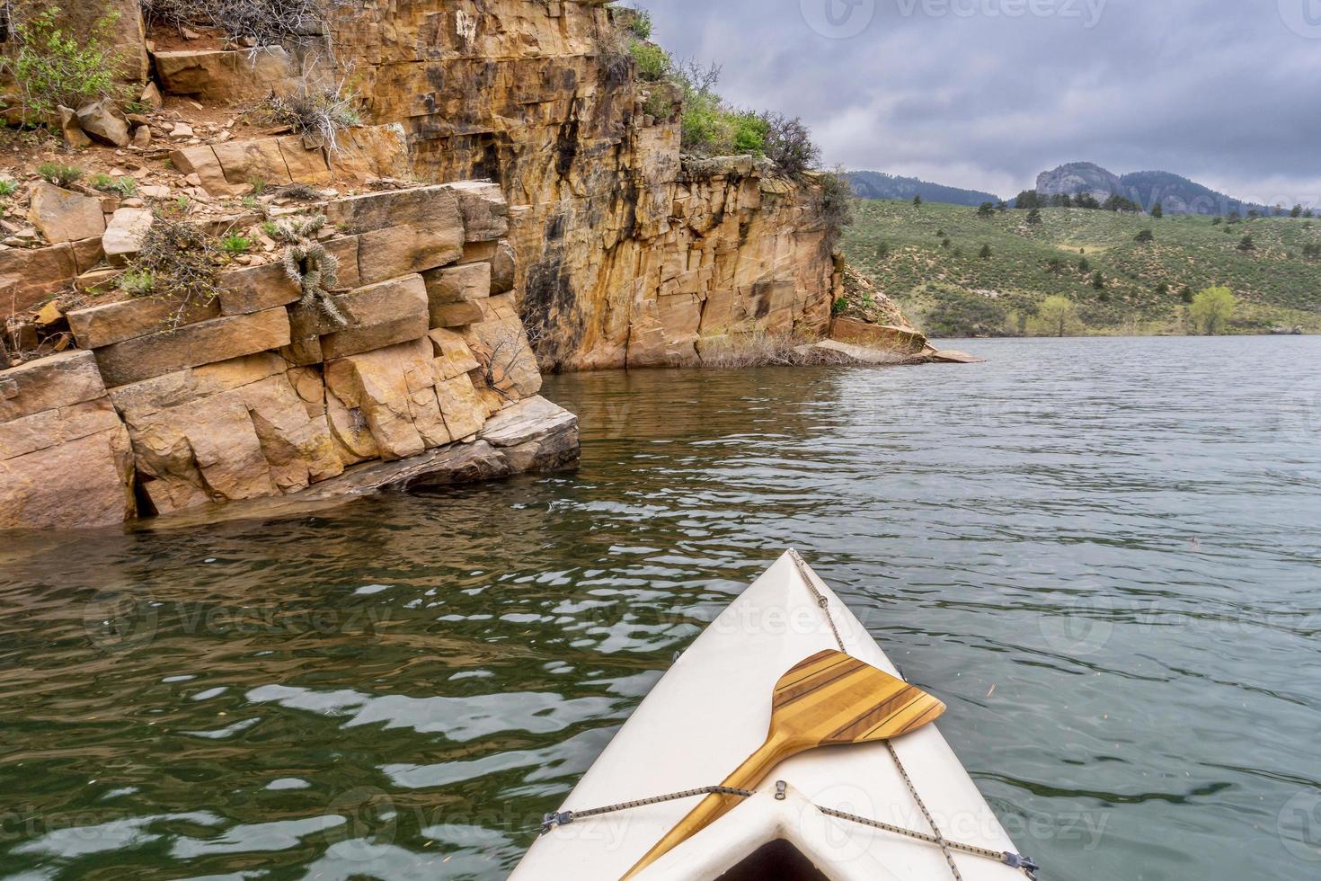 canoe and sandstone cliff photo