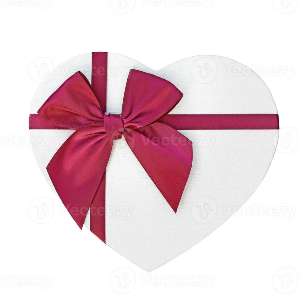 gift box with red ribbon and bow isolated on white photo
