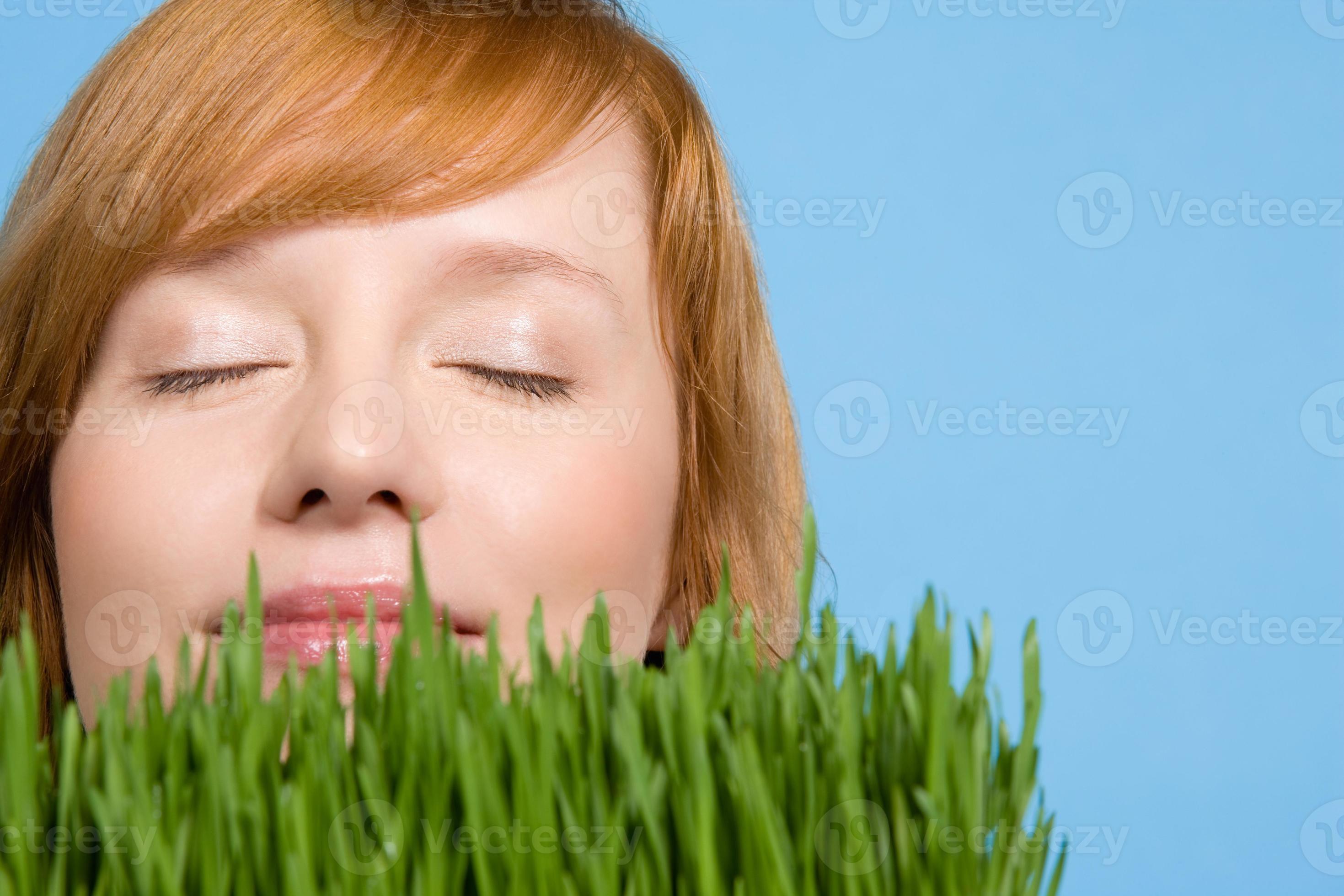 Woman smelling grass 826287 Stock Photo at Vecteezy