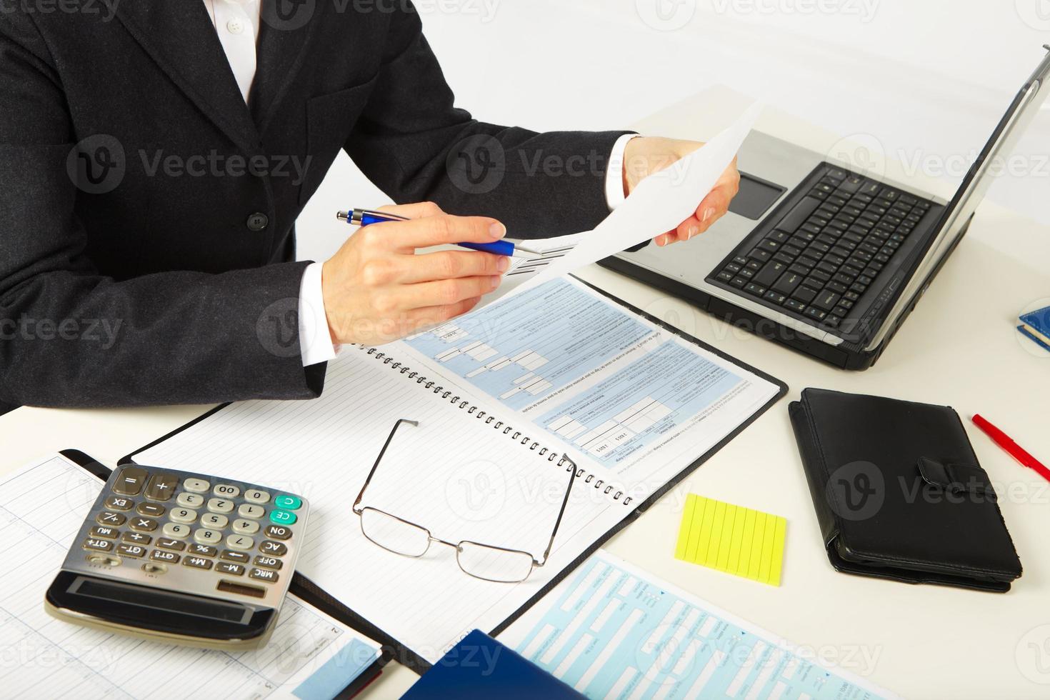 Businesswoman working with documents photo