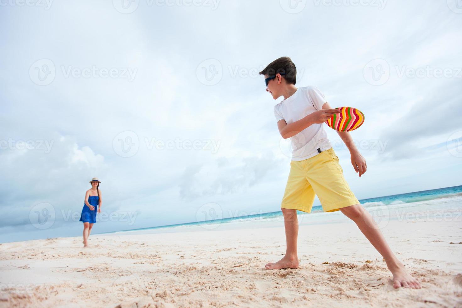 Mother and son playing frisbee photo