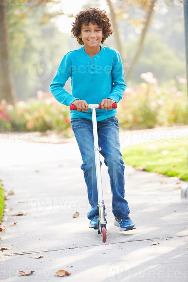 Young Boy Riding Scooter Park 833020 Stock Photo at