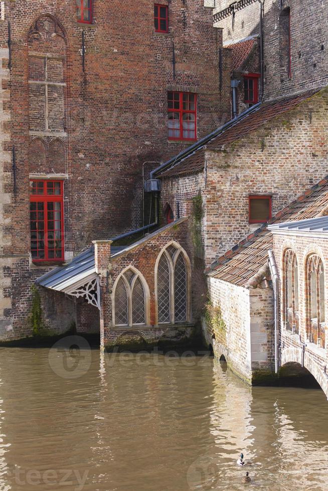 Traditional buildings and waterway, Bruges, Belgium photo