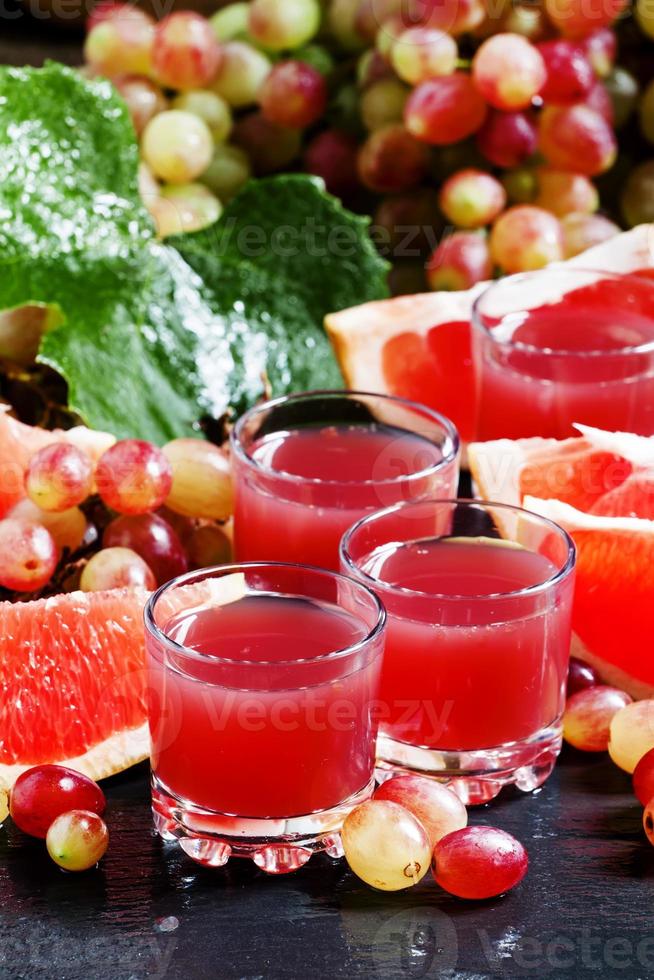 Fresh juice of red grapes and grapefruit photo