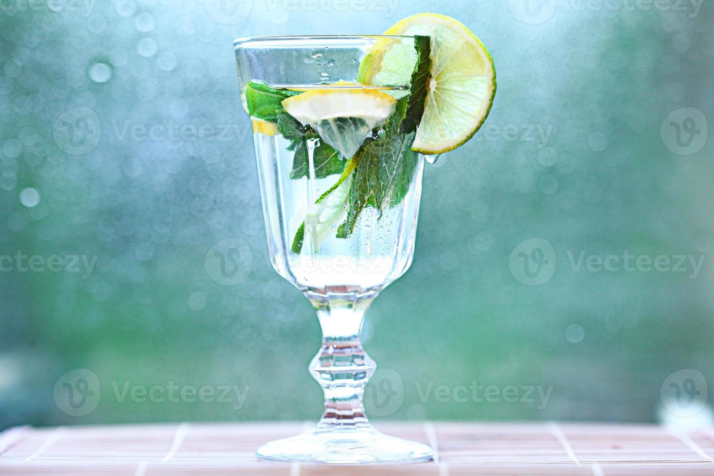 homemade lemonade lemon mint ice in a glass photo