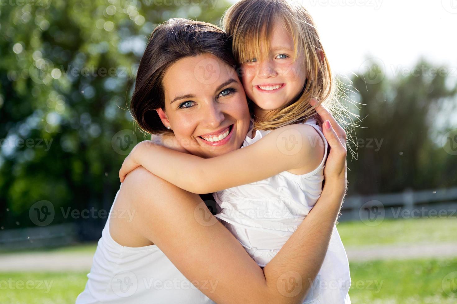 Mother and daughter having fun outdoors photo