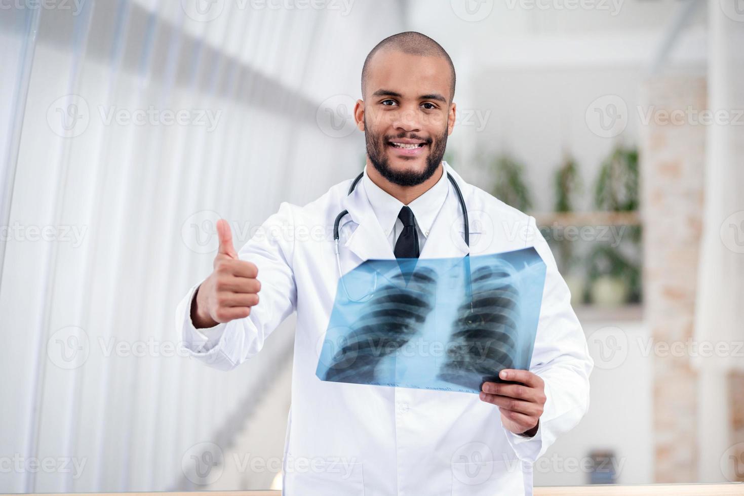 Do you have healthy lungs. Portrait of a doctor photo