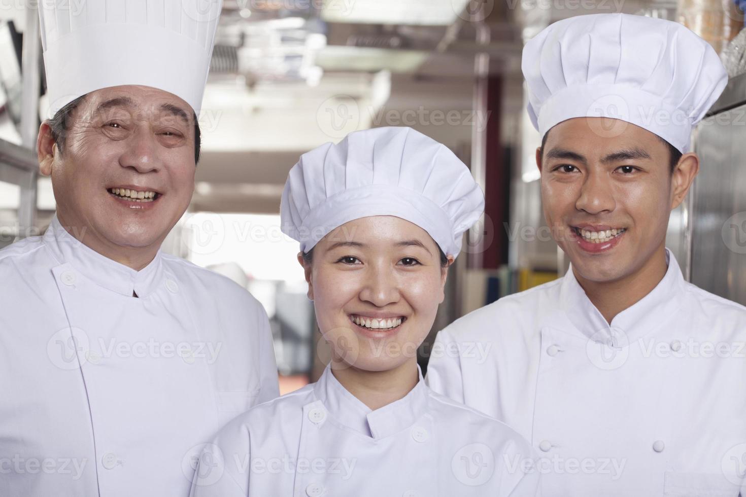 Three Chefs in an Industrial Kitchen photo