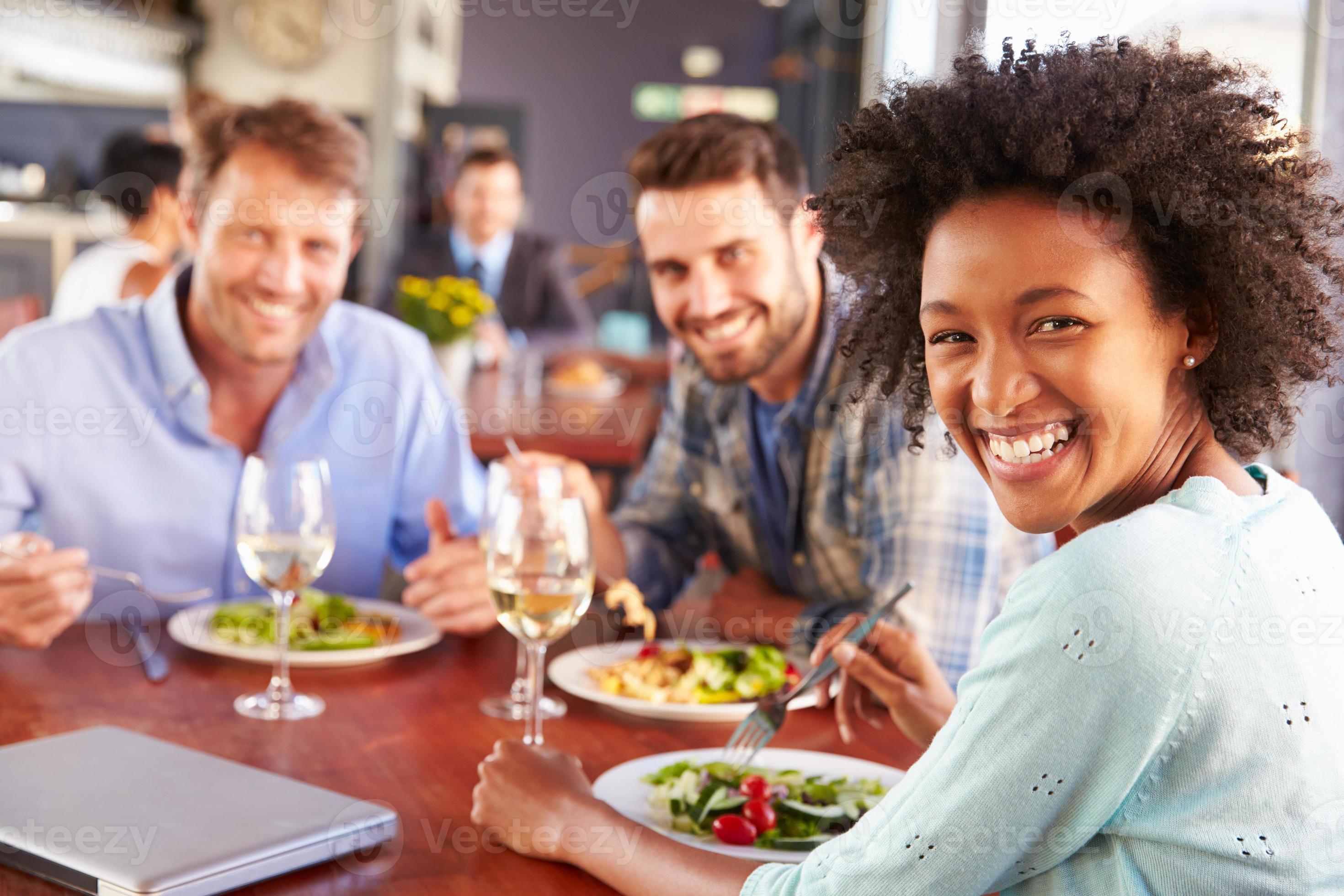 Group of friends at lunch in a restaurant 856316 Stock Photo at Vecteezy